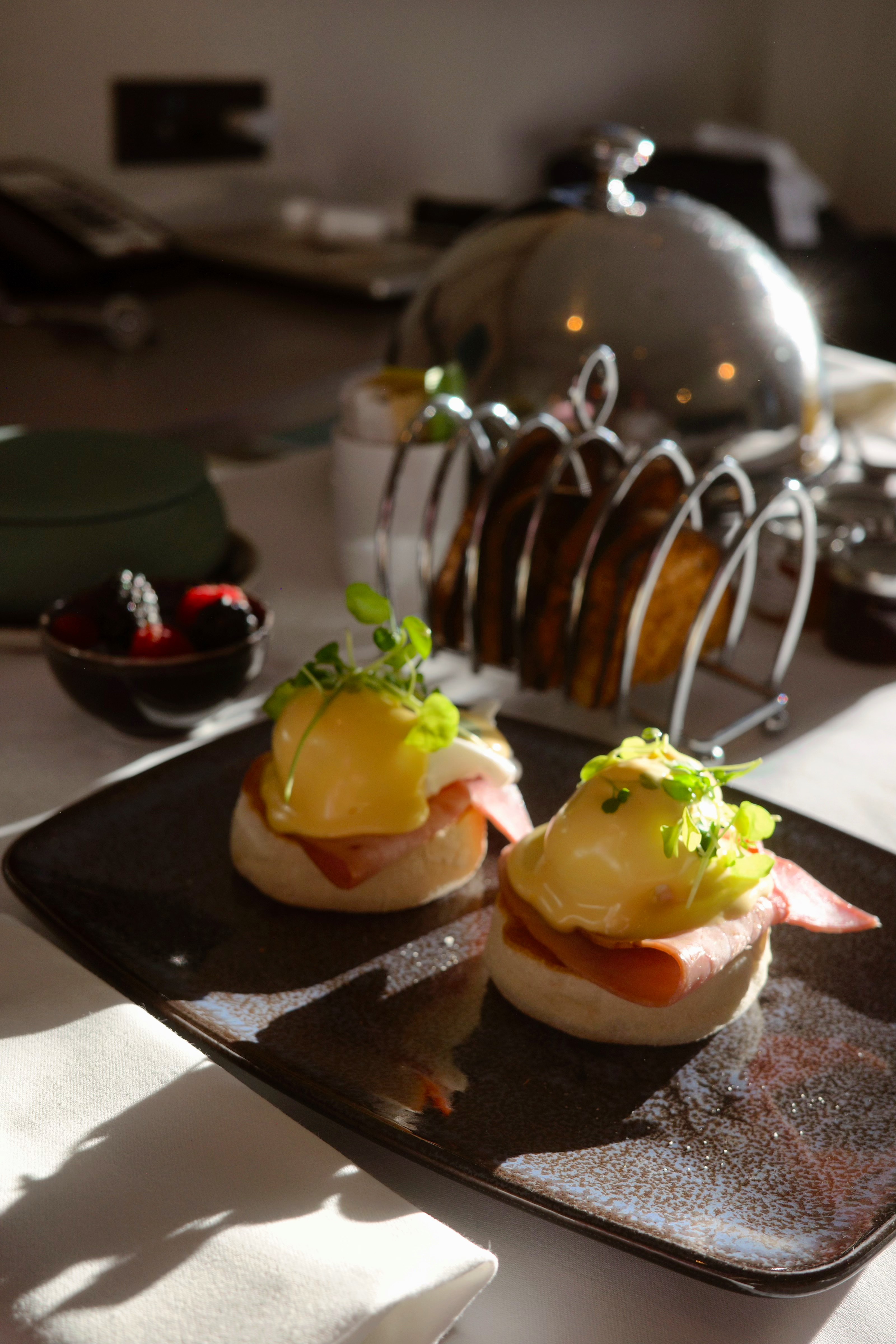 Eggs Benedict breakfast served in warm morning light