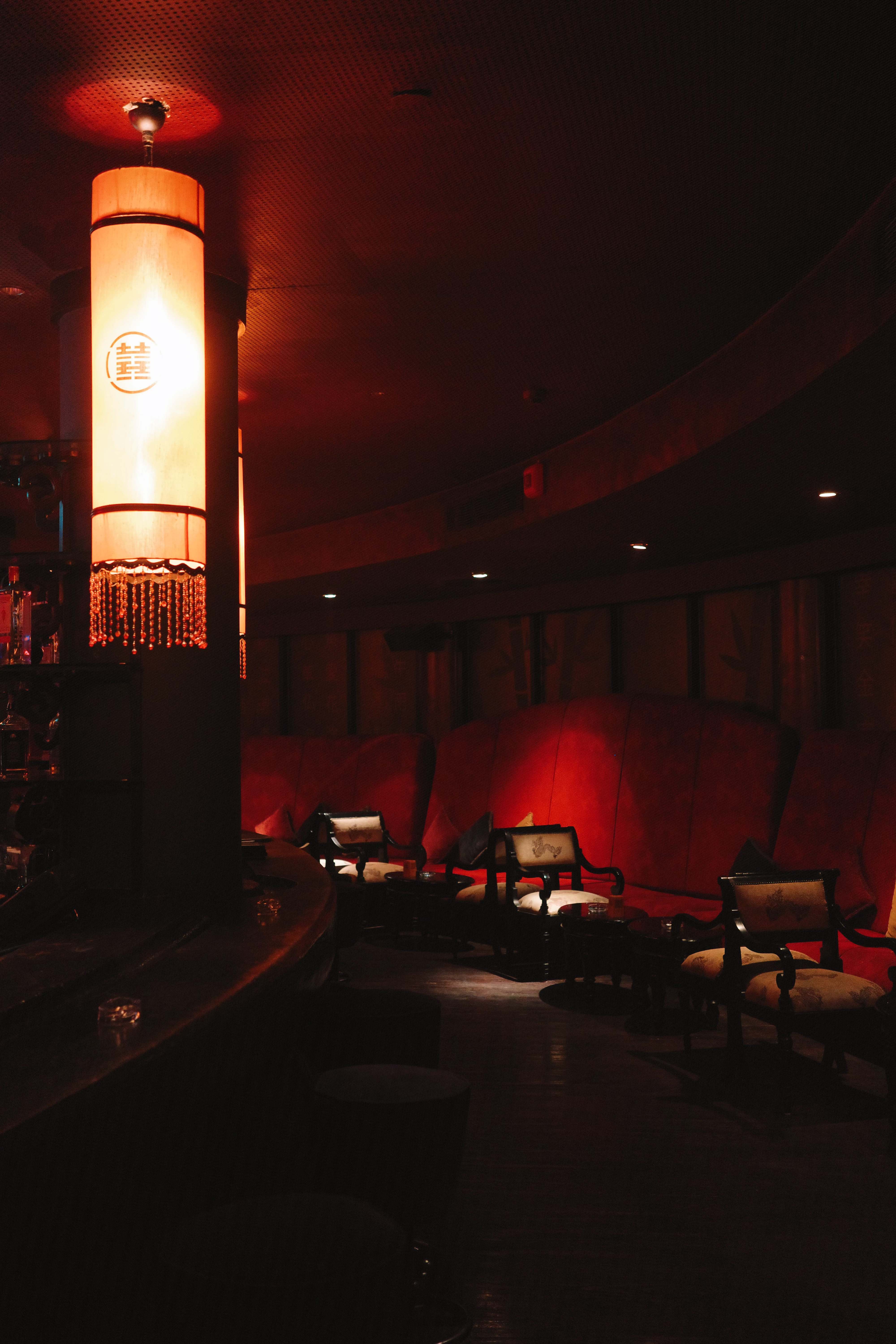 Lounge area with ornate lantern and red ambient lighting