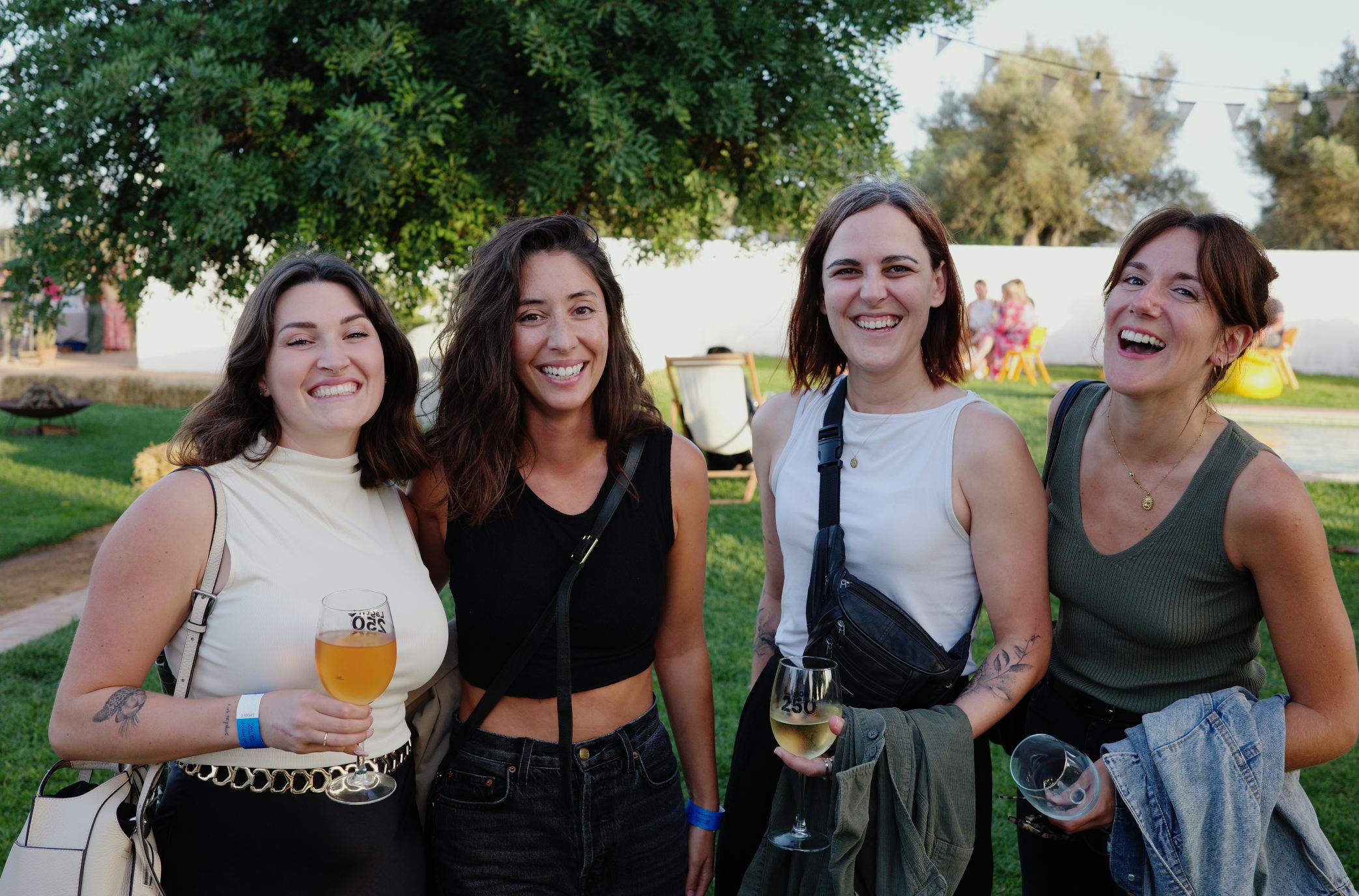 Friends enjoying wine at outdoor event