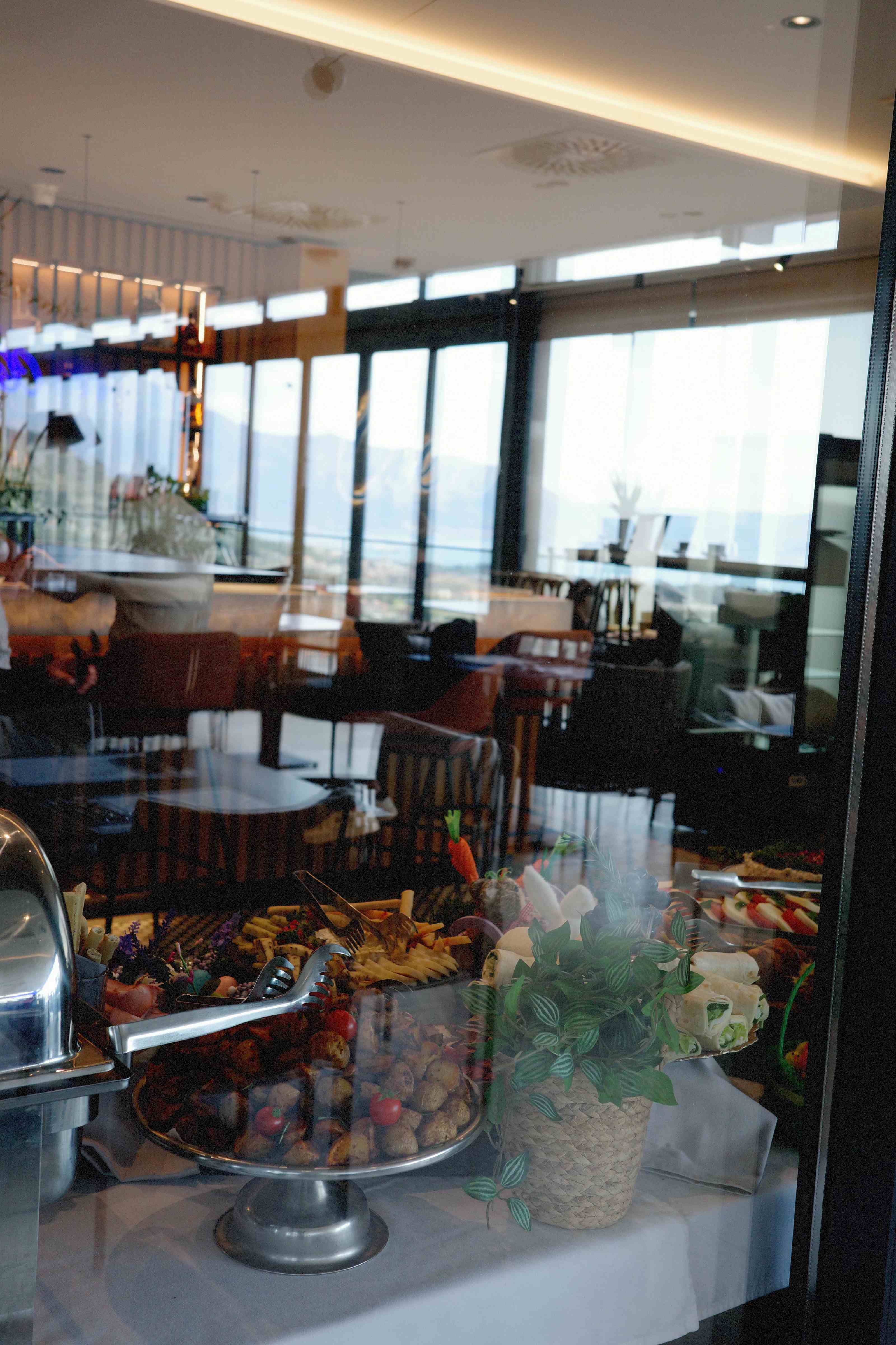Buffet spread inside the Nomio restaurant with panoramic bay views