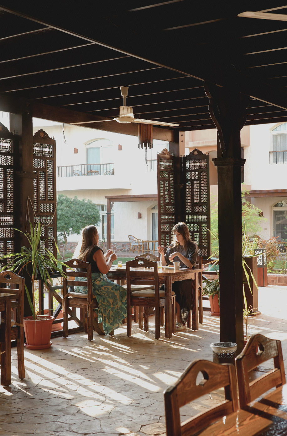 Guests dining on covered terrace
